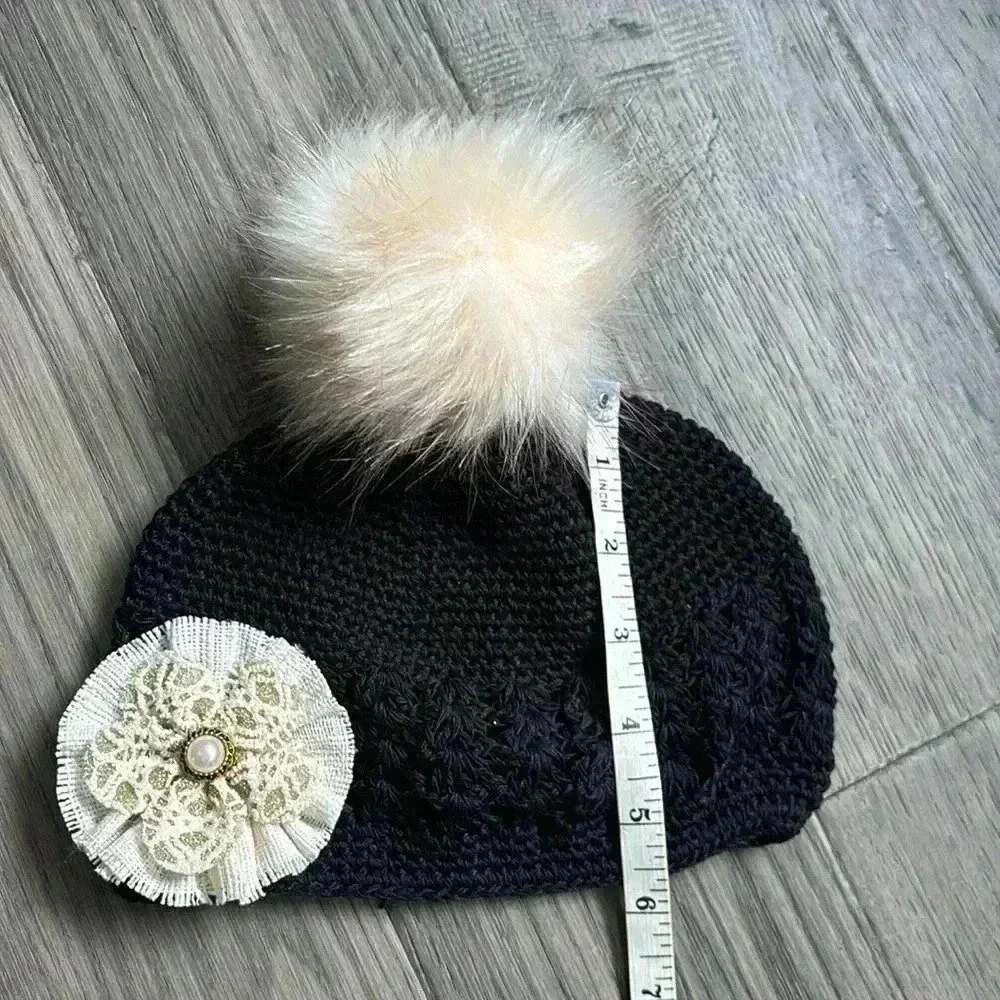 Hand crafted black crochet girls hat with flower and fuzzy pom pom - Picture 7 of 9
